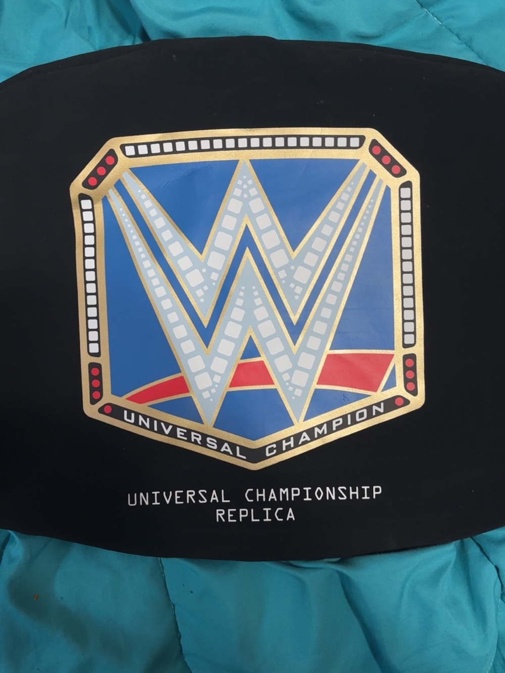 WWE Black Jacket with Turquoise Panels and Gold Emblem